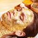 Gold for cash -Woman having a gold facial