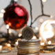 a pile of cash with jewellery in the background