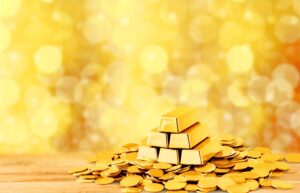 A selection of gold coins on a gold background