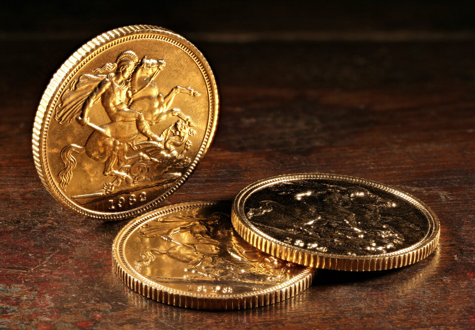 Three Gold Sovereigns on Table